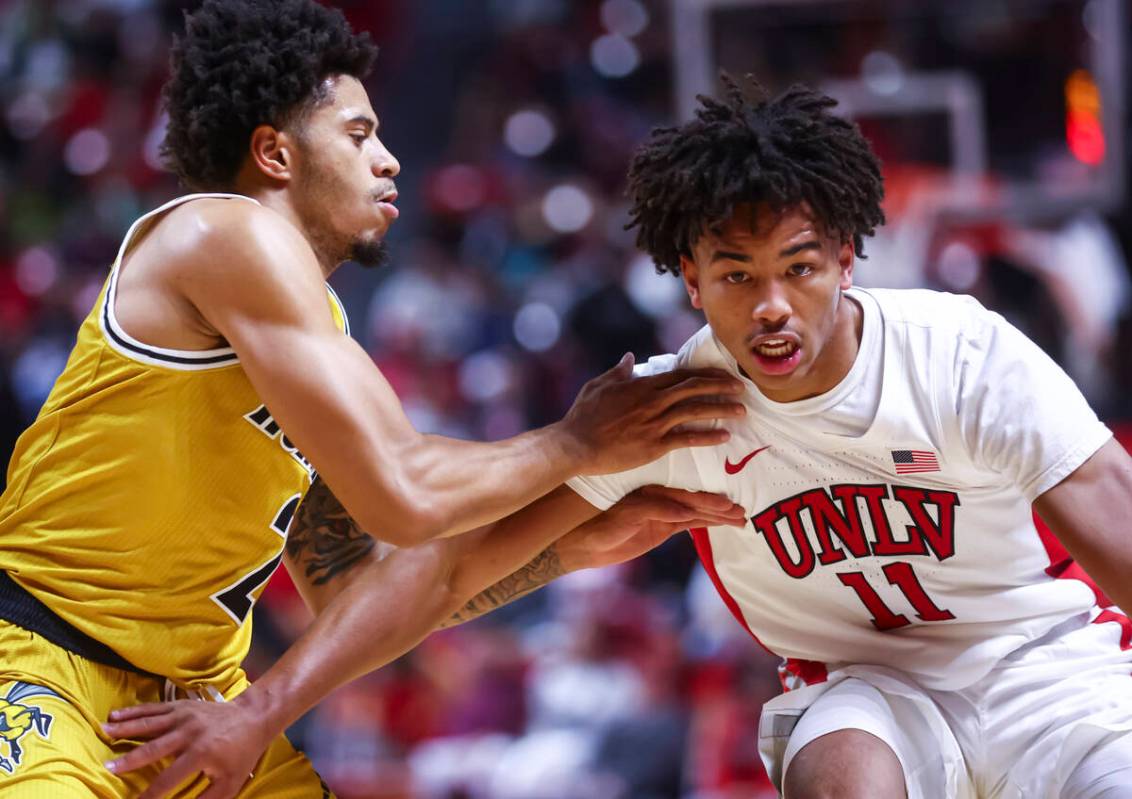 UNLV Rebels guard Dedan Thomas Jr. (11) drives the ball against Alabama State Hornets guard Mic ...