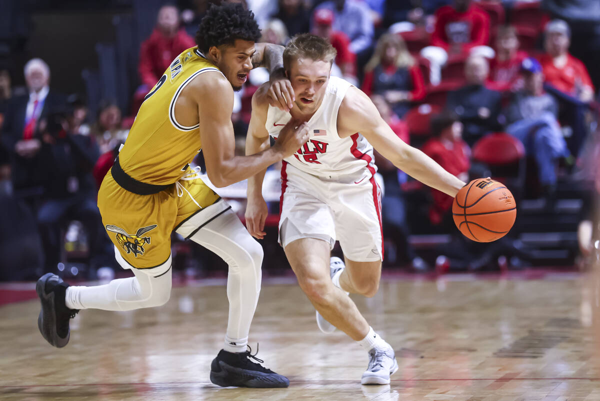 UNLV Rebels guard Jace Whiting (15) brings the ball up court against Alabama State Hornets guar ...