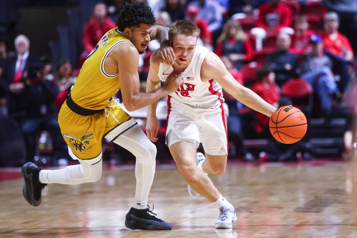 UNLV Rebels guard Jace Whiting (15) brings the ball up court against Alabama State Hornets guar ...