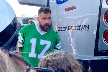 Retired Philadelphia Eagles center Jason Kelce waits to suprise fans at an impromptu appearance ...