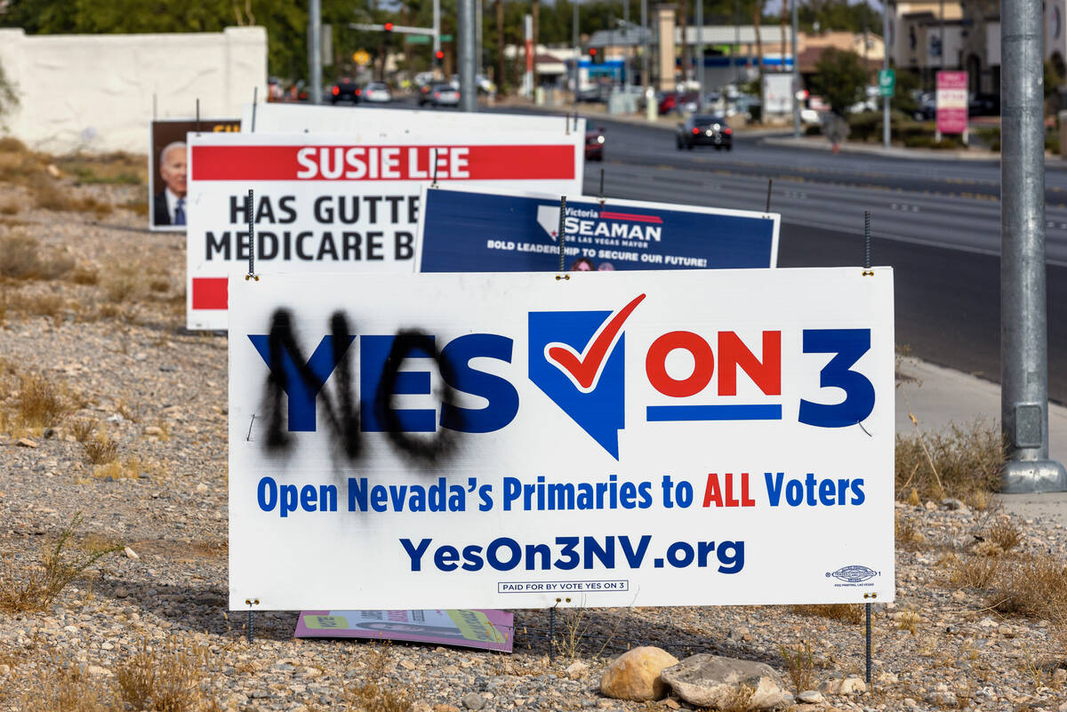 A vandalized election sign is seen along Buffalo Drive in Las Vegas Tuesday, Nov. 5, 2024. (L.E ...