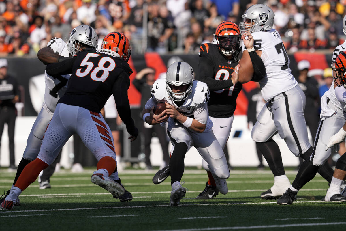 Cincinnati Bengals defensive end Trey Hendrickson (91) sacks Las Vegas Raiders quarterback Gard ...