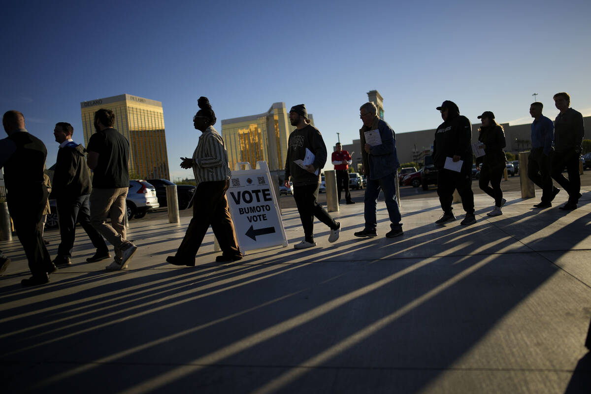 People line up to vote outside Allegiant Stadium, Tuesday, Nov. 5, 2024, in Las Vegas. (AP Phot ...