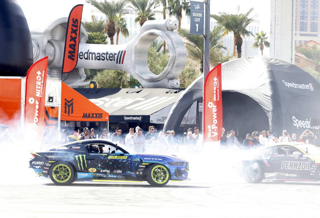 A professional drivers put on a tire slaying show at Hoonigan’s burn pit during the firs ...