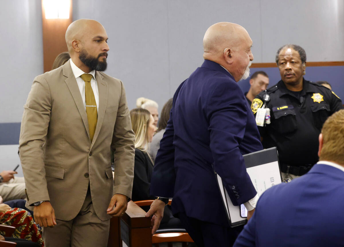 Metropolitan Police Department Sgt. Kevin Menon, left, appears in court with his attorney Domin ...