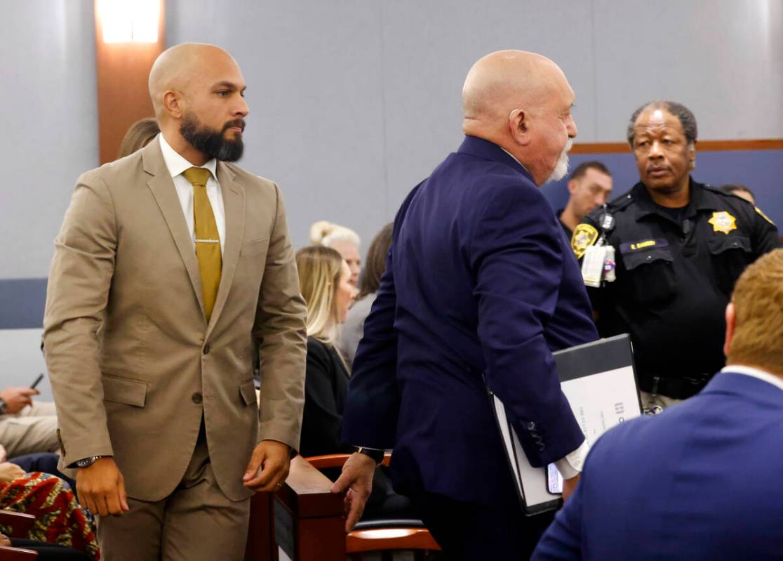 Metropolitan Police Department Sgt. Kevin Menon, left, appears in court with his attorney Domin ...