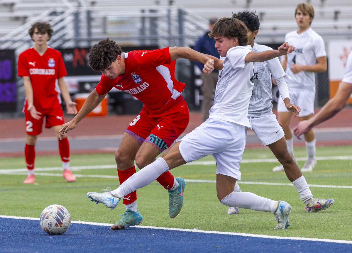 Coronado striker Dylan Flores (9) battles past Palo Verde forward Luke Knecht (4) for another ...