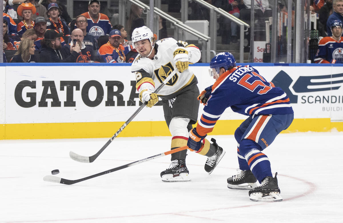 Vegas Golden Knights' Alexander Holtz (26) has his shot deflected by Edmonton Oilers' Troy Stec ...