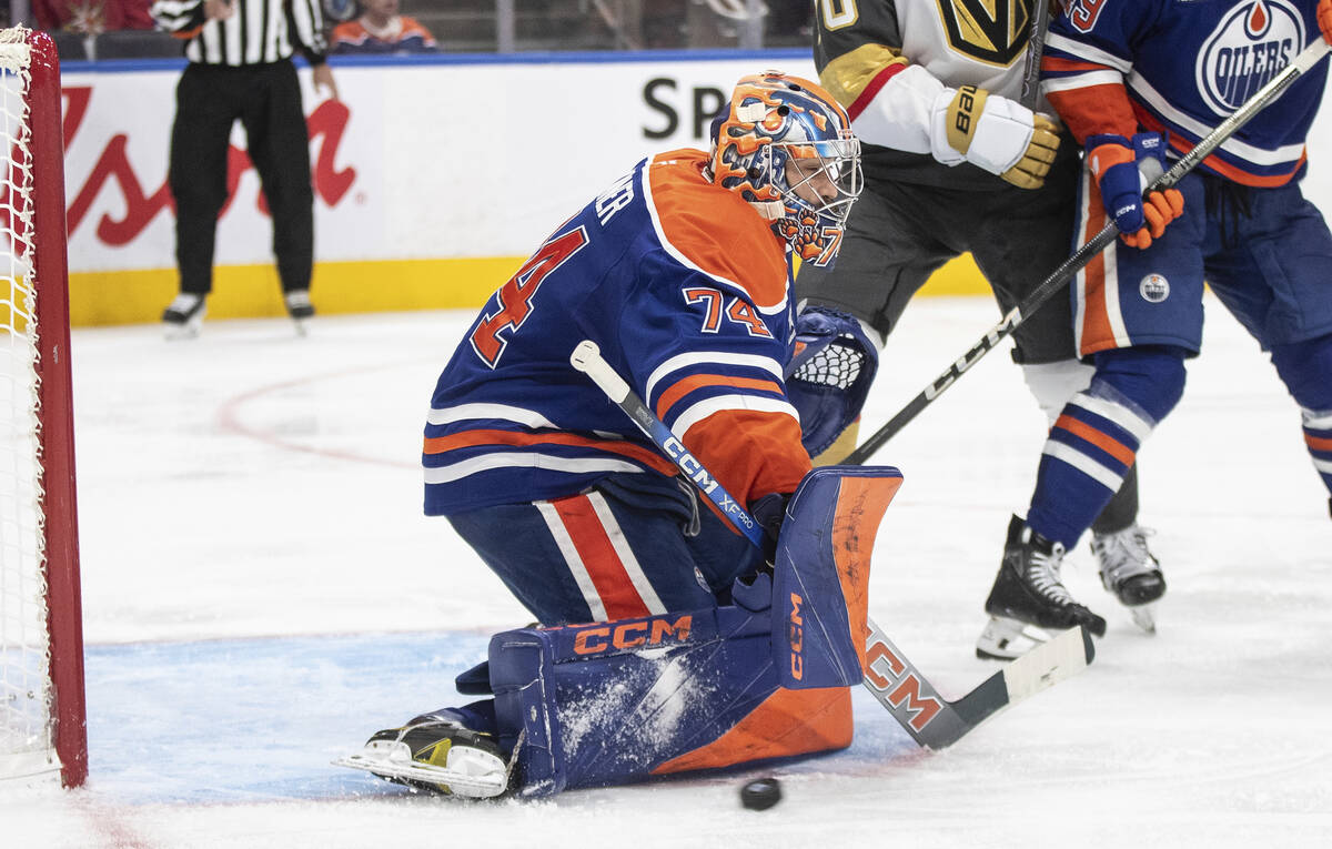 Edmonton Oilers' goalie Stuart Skinner (74) makes a save against the Vegas Golden Knights durin ...