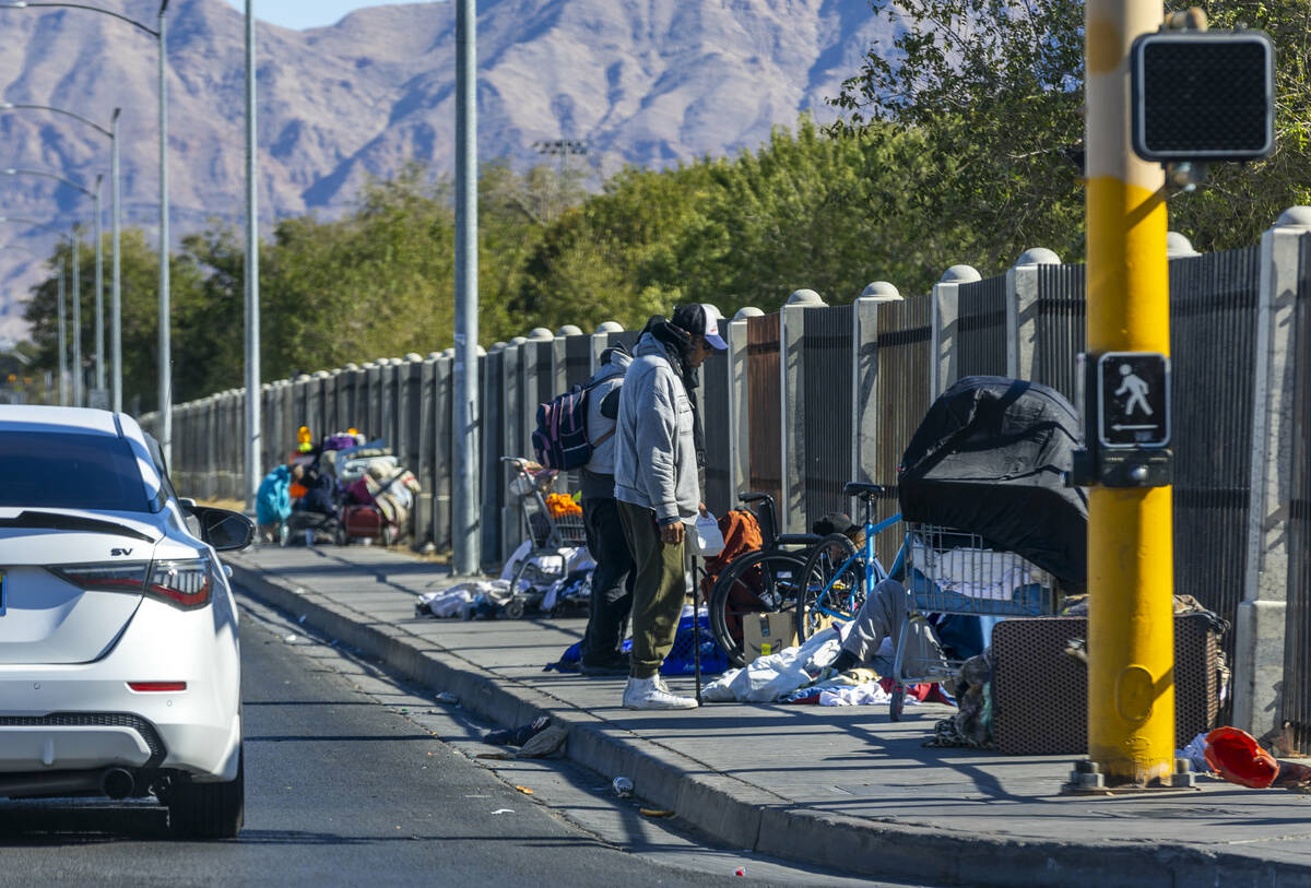 Homeless campers claim spots on the sidewalk along Owens Avenue on Wednesday, Nov. 6, 2024, in ...