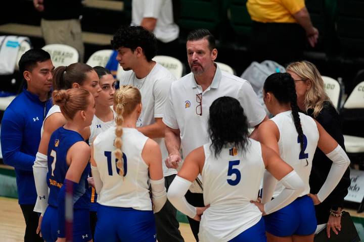 San Jose State head coach Todd Kress, back center, talks to his players during a timeout in the ...