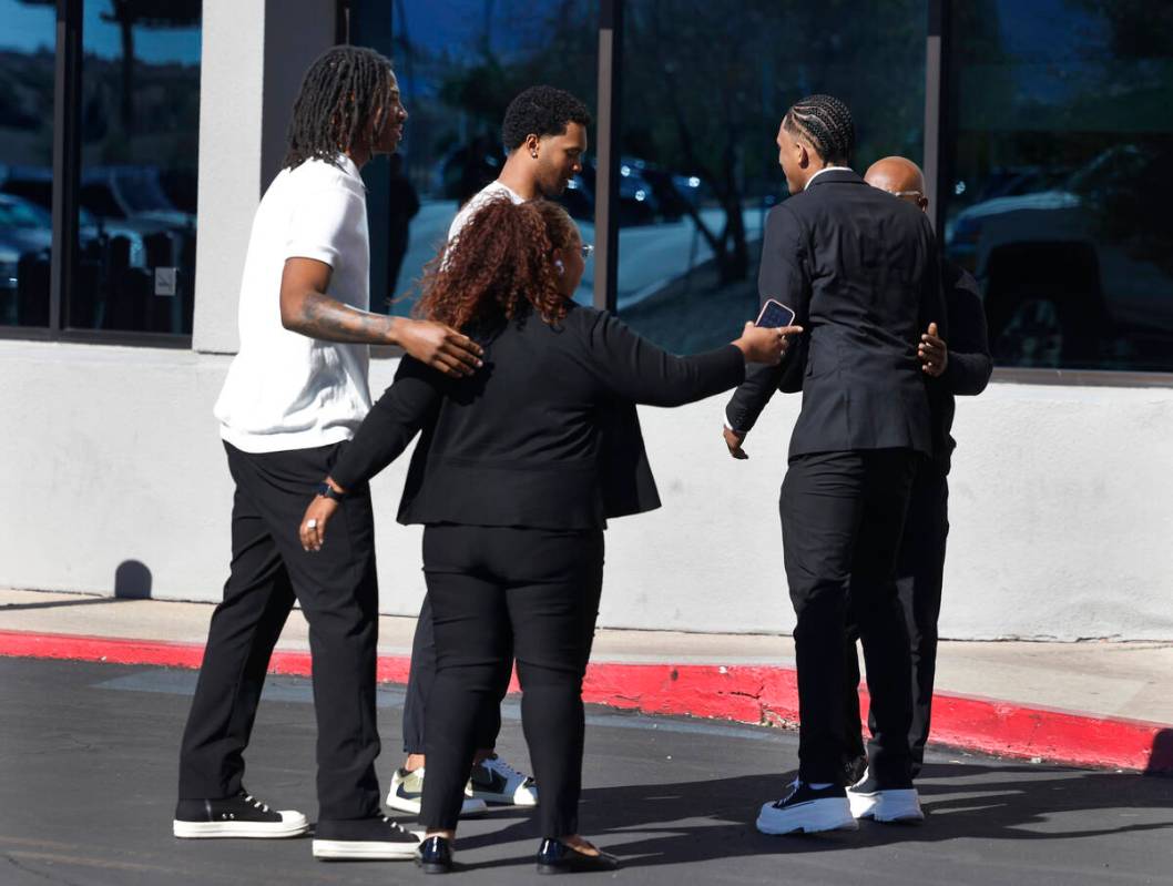 Mourners comfort each other outside of Central Church on Thursday, Nov. 7, 2024, in Henderson w ...