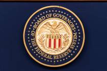 The seal of The Federal Reserve System is seen during a news conference by Federal Reserve Boar ...