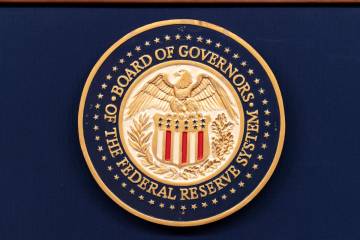 The seal of The Federal Reserve System is seen during a news conference by Federal Reserve Boar ...