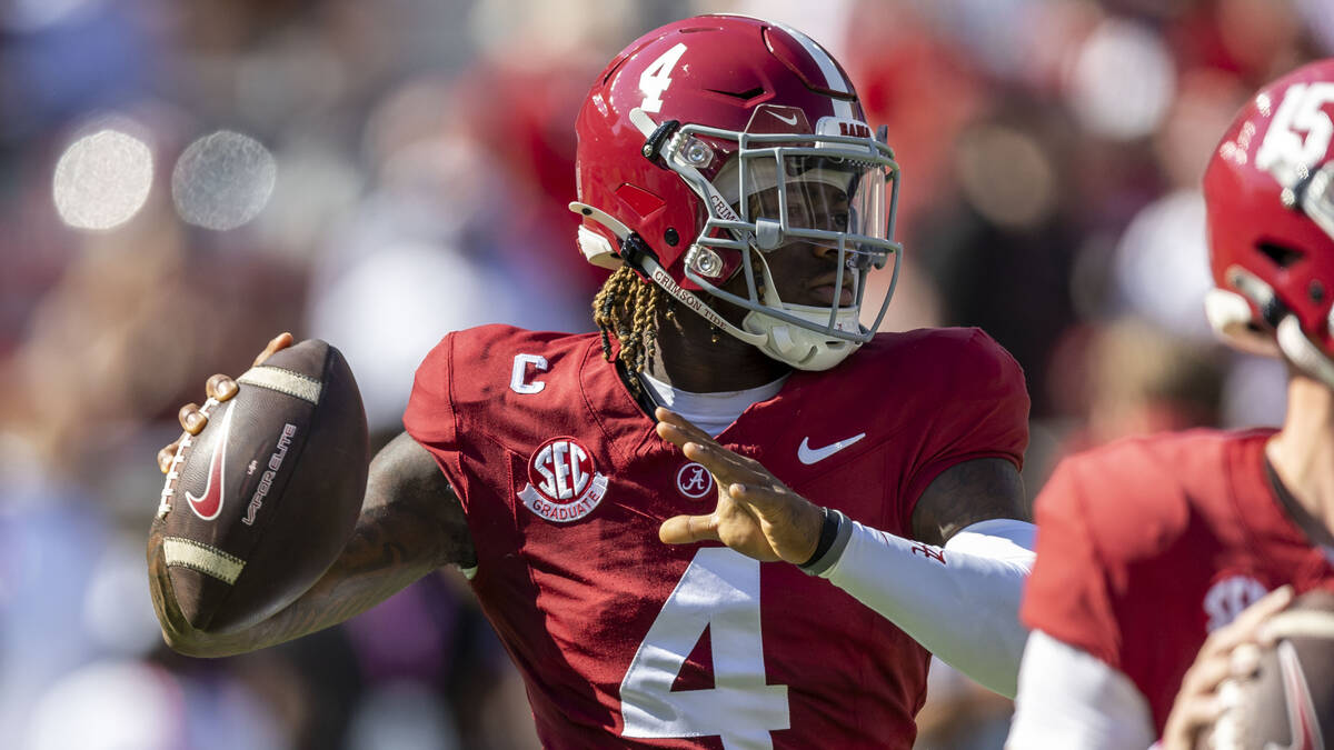 Alabama quarterback Jalen Milroe (4) warms up before an NCAA college football game against Miss ...