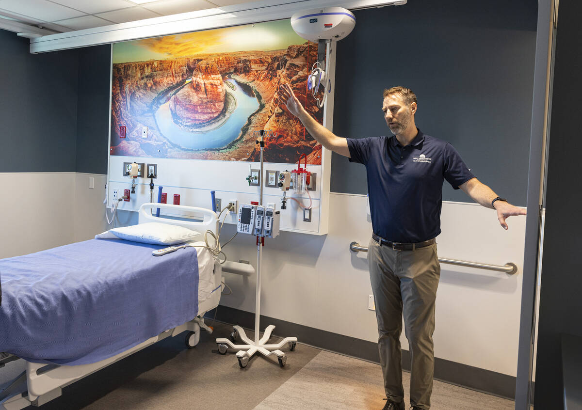 Chris Loftus, CEO of West Henderson Hospital, leads a tour of a patient room at the new hospita ...