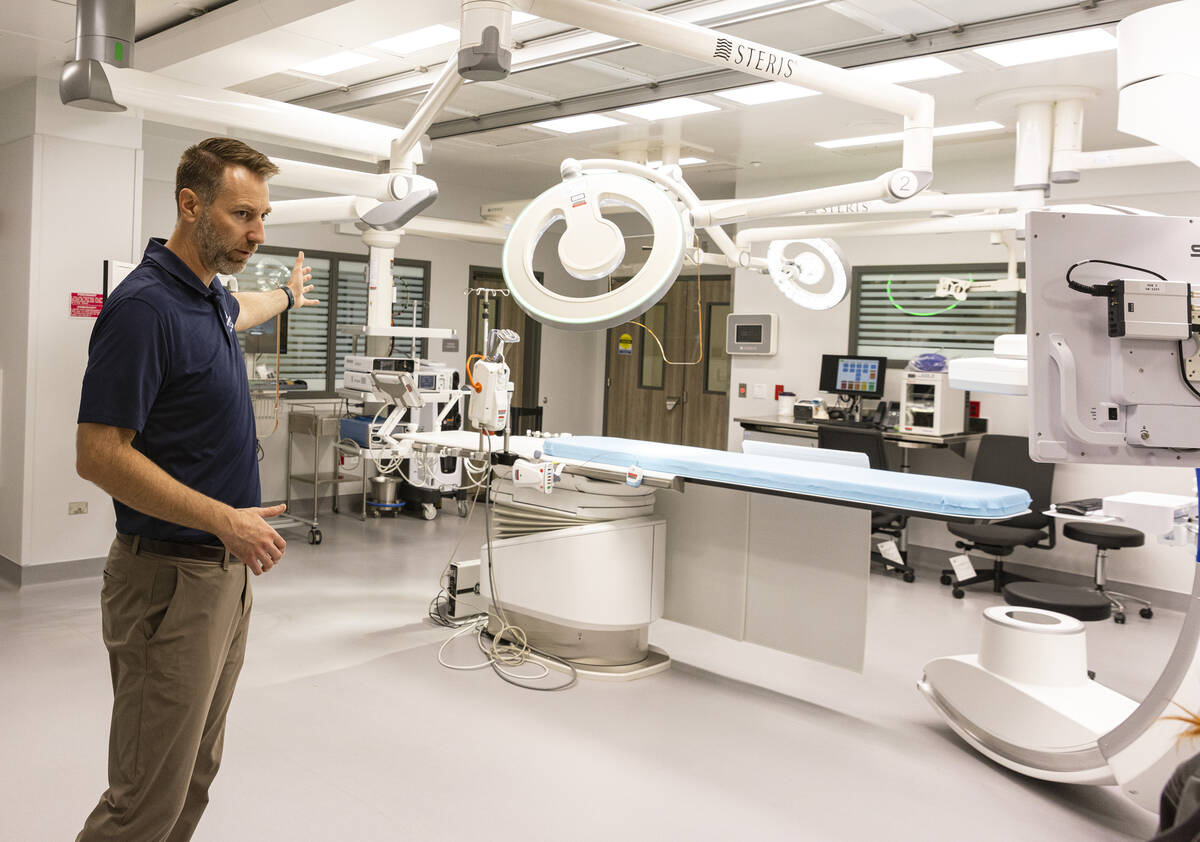 Chris Loftus, CEO of West Henderson Hospital, leads a tour of a hybrid operating room at the ne ...