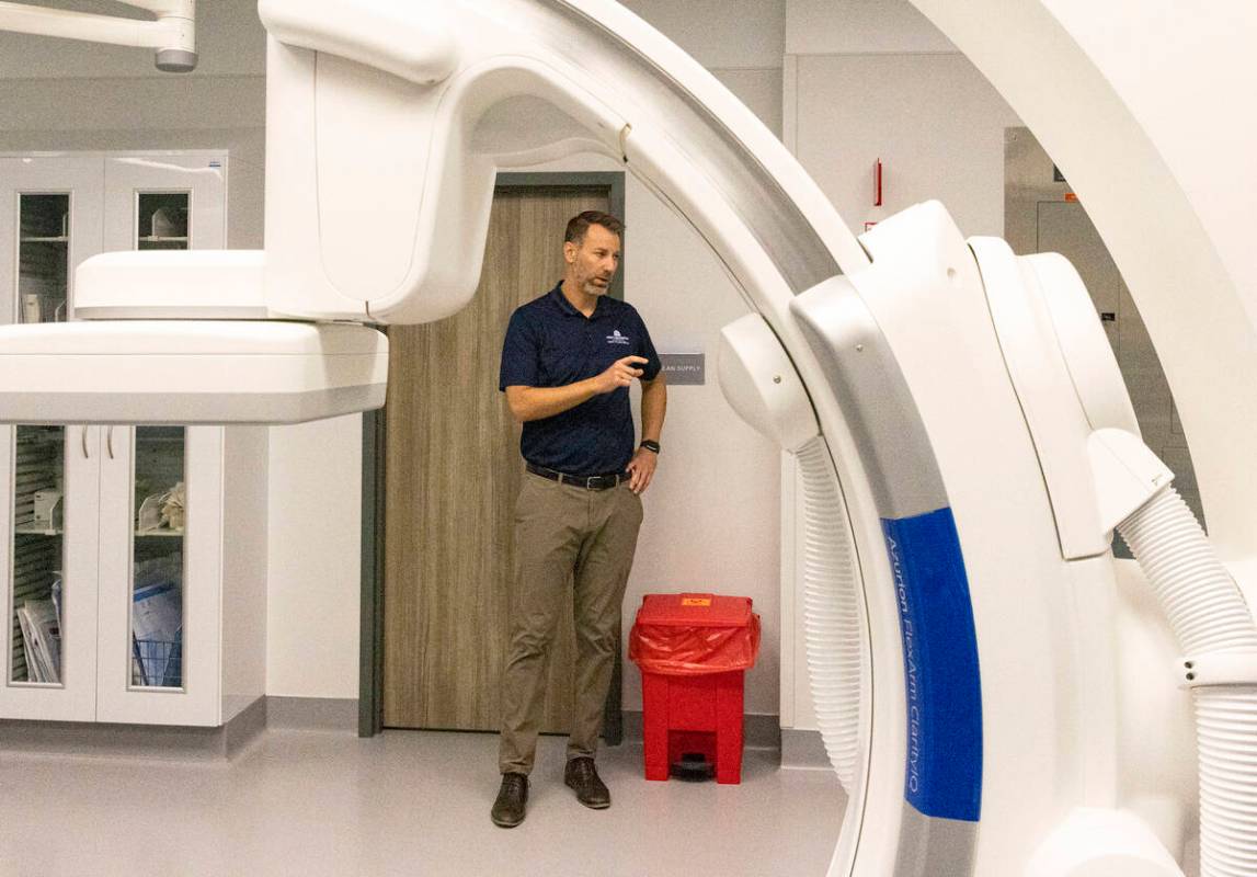 Chris Loftus, CEO of West Henderson Hospital, leads a tour the cardiac catheterization laborato ...