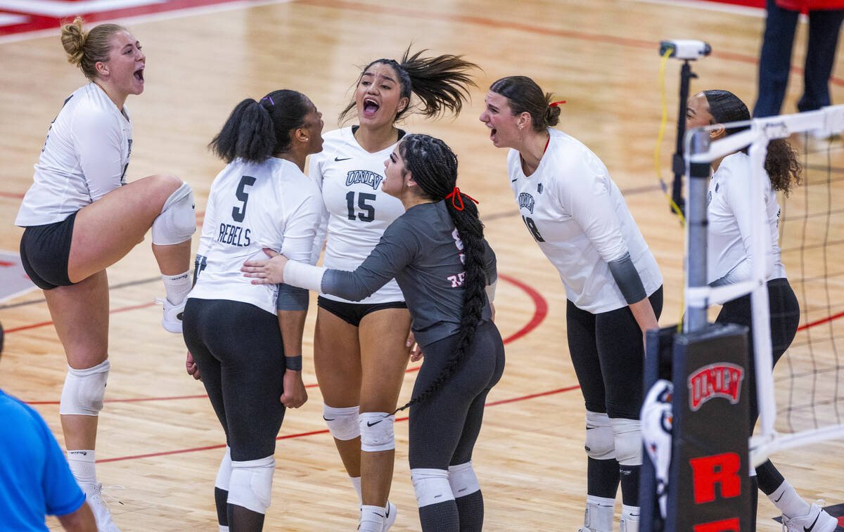 UNLV players celebrate a critical point as they take the first set against San Jose State durin ...