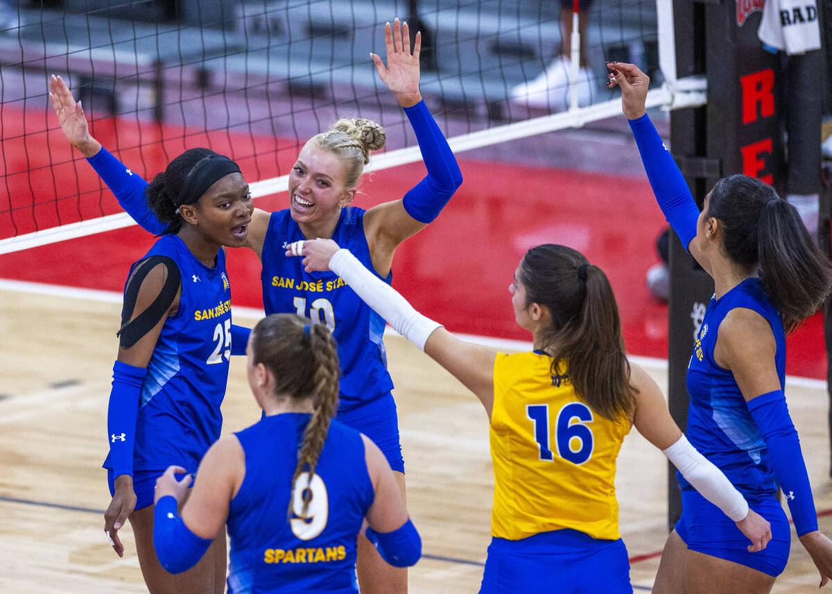 San Jose State setter Brooke Slusser (10) celebrates a point with teammates against UNLV during ...