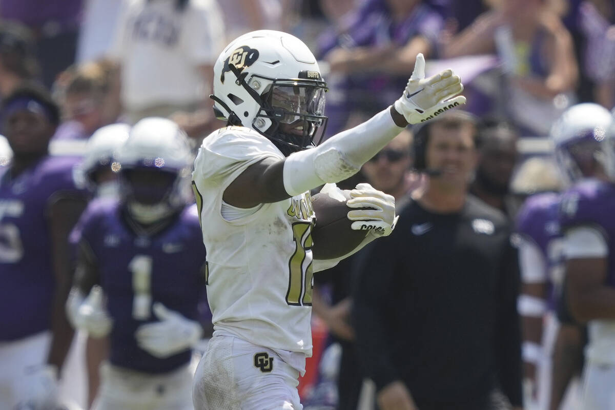 Colorado cornerback Travis Hunter motions after a catch for a first down against TCU during the ...