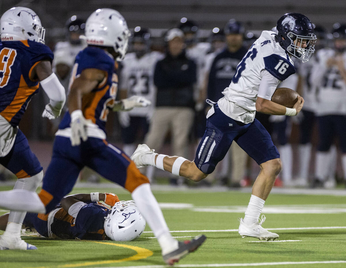 Shadow Ridge quarterback Gage Crnkovic (16) breaks a Legacy tackle attempt for a run during the ...