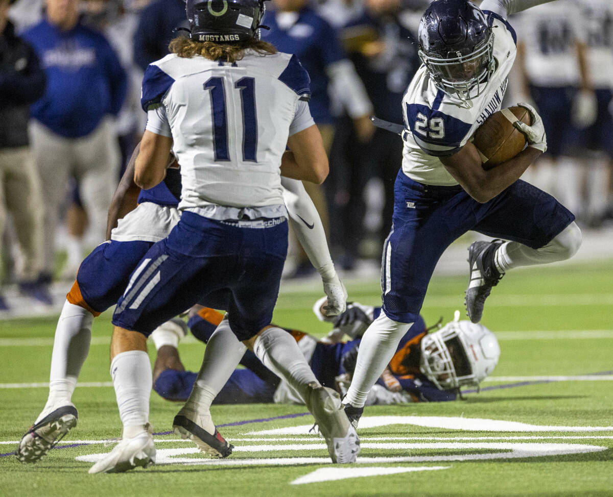 Shadow Ridge fullback Trevin Young (29) evades a Legacy tackle attempt during the first half of ...