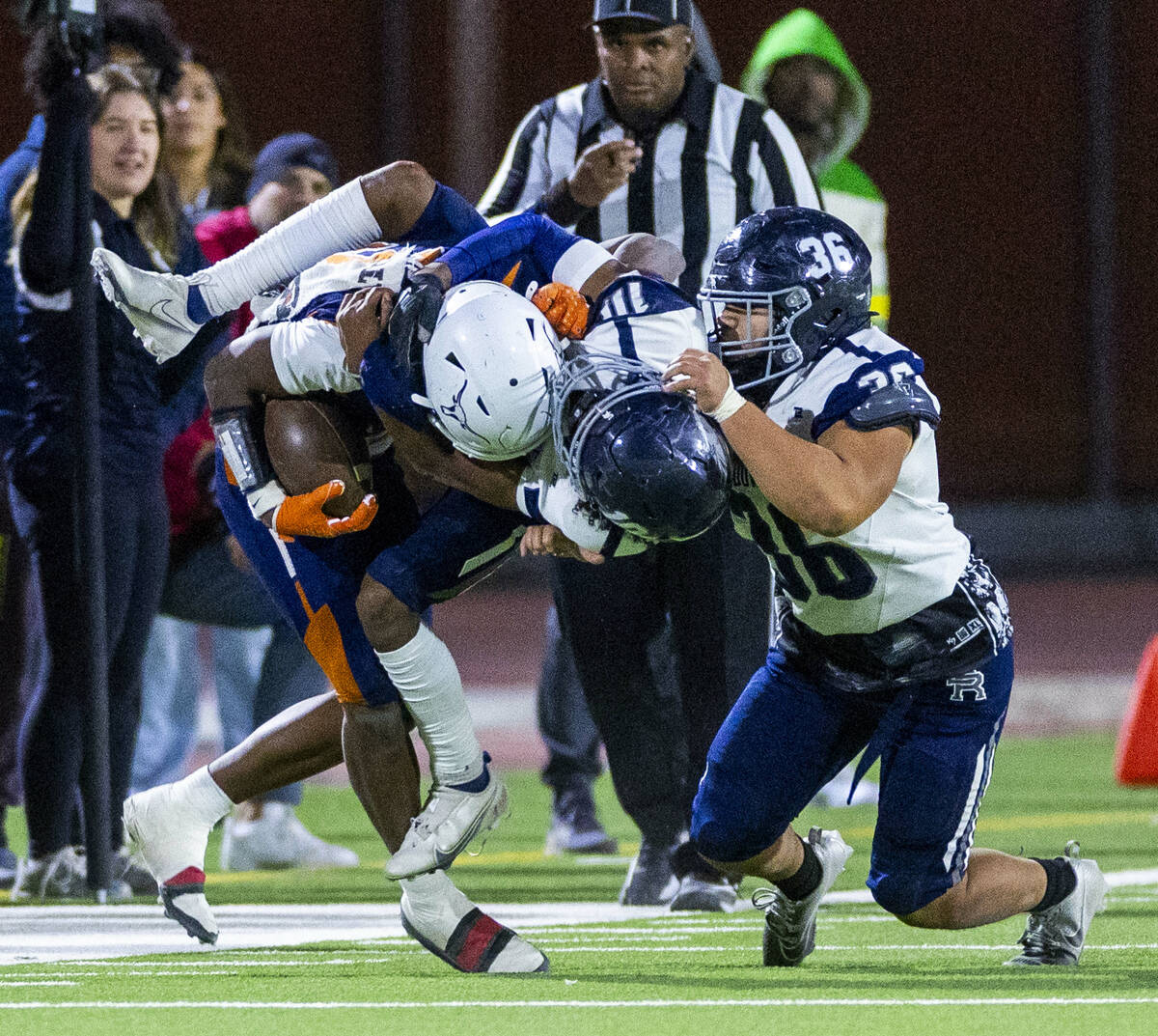 Legacy halfback Caden Bridgewater (3) is tackled by Shadow Ridge cornerback Ray Carmel (10) and ...