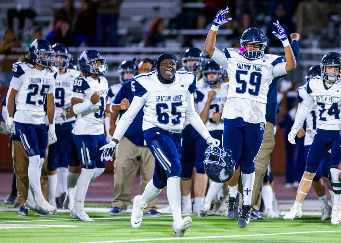 Shadow Ridge players celebrate their win over Legacy ending the second half of their Class 5A D ...