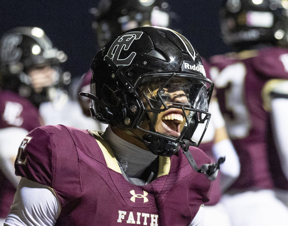 Faith Lutheran junior Rouselle Shepard (4) celebrates a touchdown during the 5A Division II Sou ...