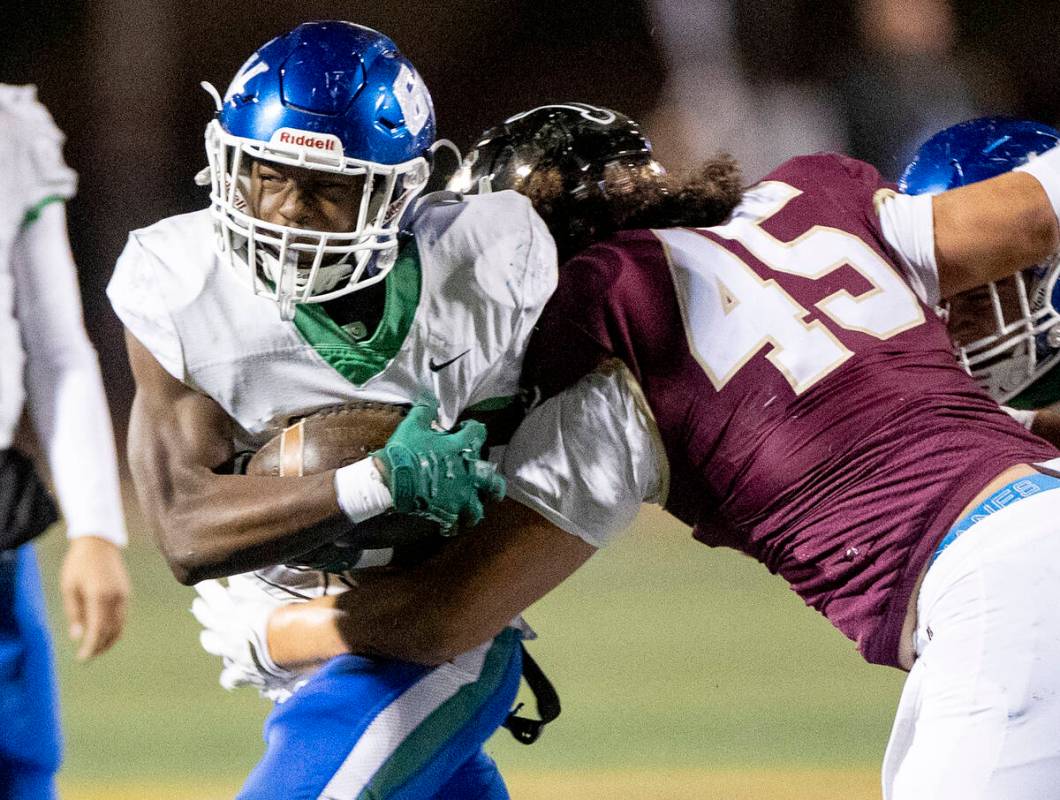 Green Valley junior Elyjah Cobwell (23) runs with the ball during the 5A Division II Southern L ...