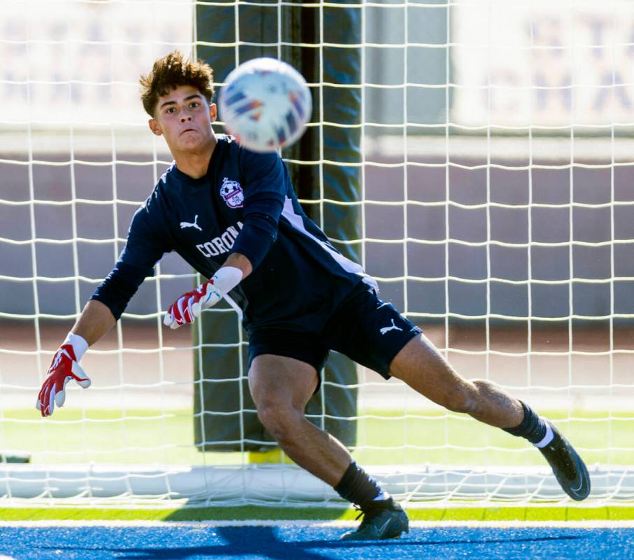 Coronado goalkeeper Logan Pierce (13) eyes a kick as they will face Wooster during the first ha ...