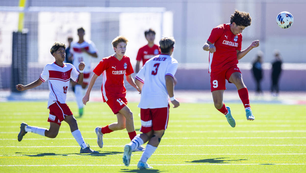 Coronado striker Dylan Flores (9) heads the ball upfield as Wooster midfielder Jiovanni Villa H ...