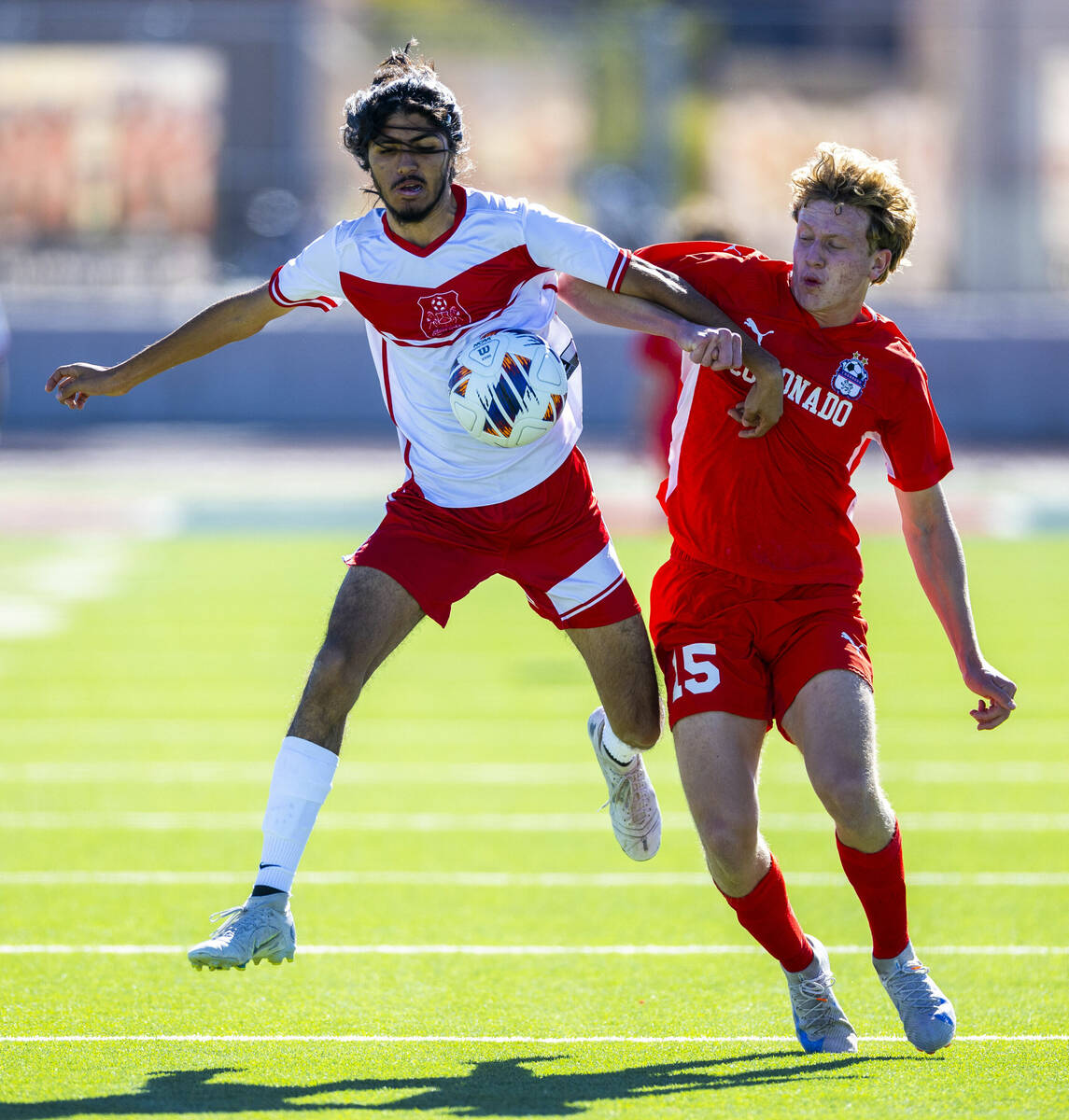 Wooster midfielder Luis Lopez Martinez (17) controls the ball against Coronado defender Ben Aro ...