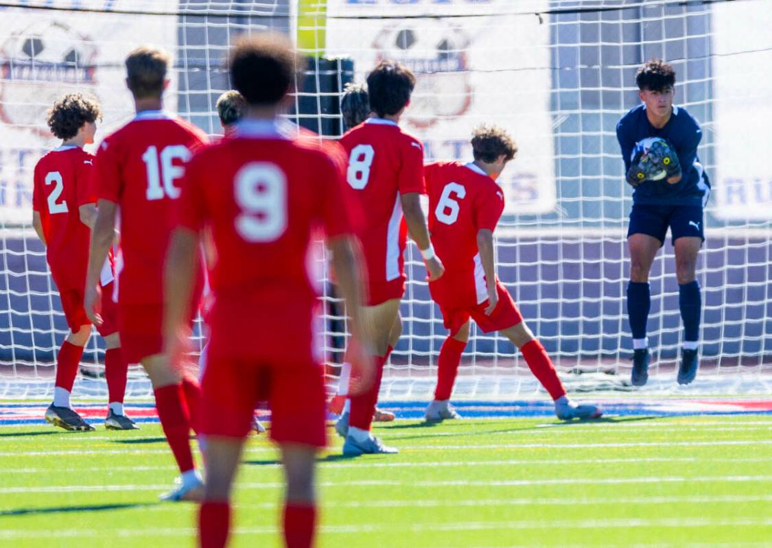 Coronado goalkeeper Logan Pierce (13) secures a shot on goal from Wooster during the first half ...