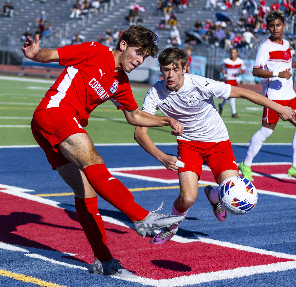 Coronado striker Gavin Flickinger (11) shoots at the goal past Wooster defender Christopher Nog ...