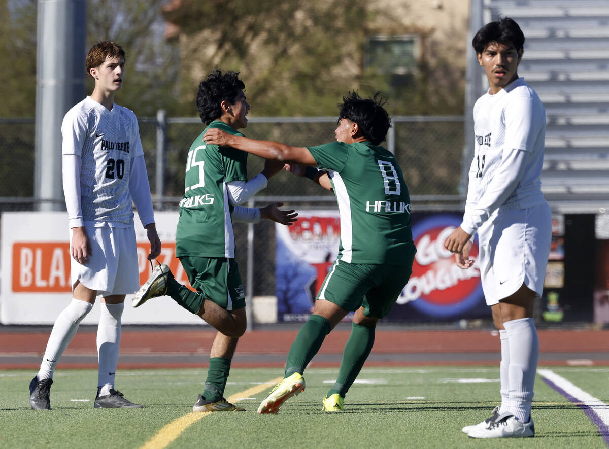 Hug High's Julian Enriquez (25) celebrates his goal with his teammate Jordan Talavera (8) as Pa ...