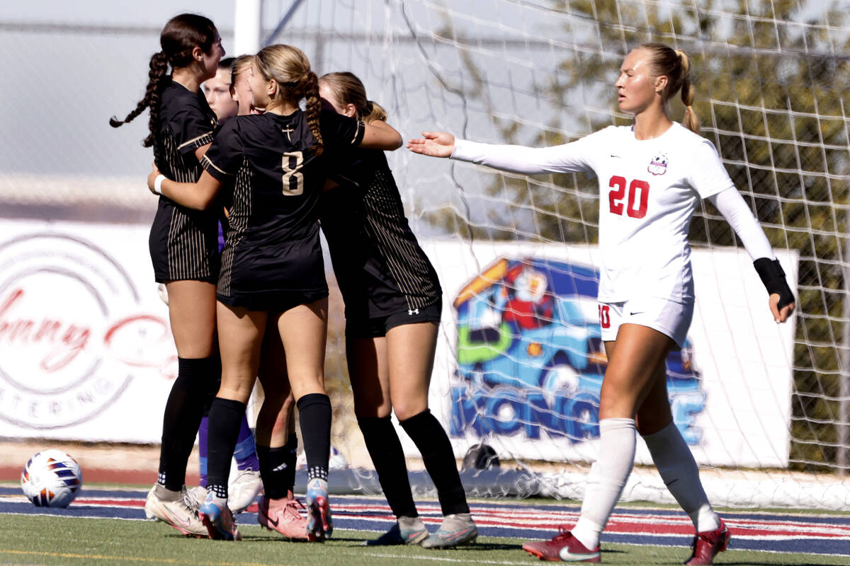 Coronado High's defender Cate Gusick (20) reacts as Faith Lutheran's players celebrate striker ...