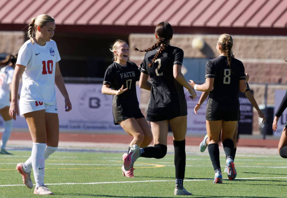 Faith Lutheran's forward Olivia Stark (8) celebrates her goal with teammates as Coronado midfie ...