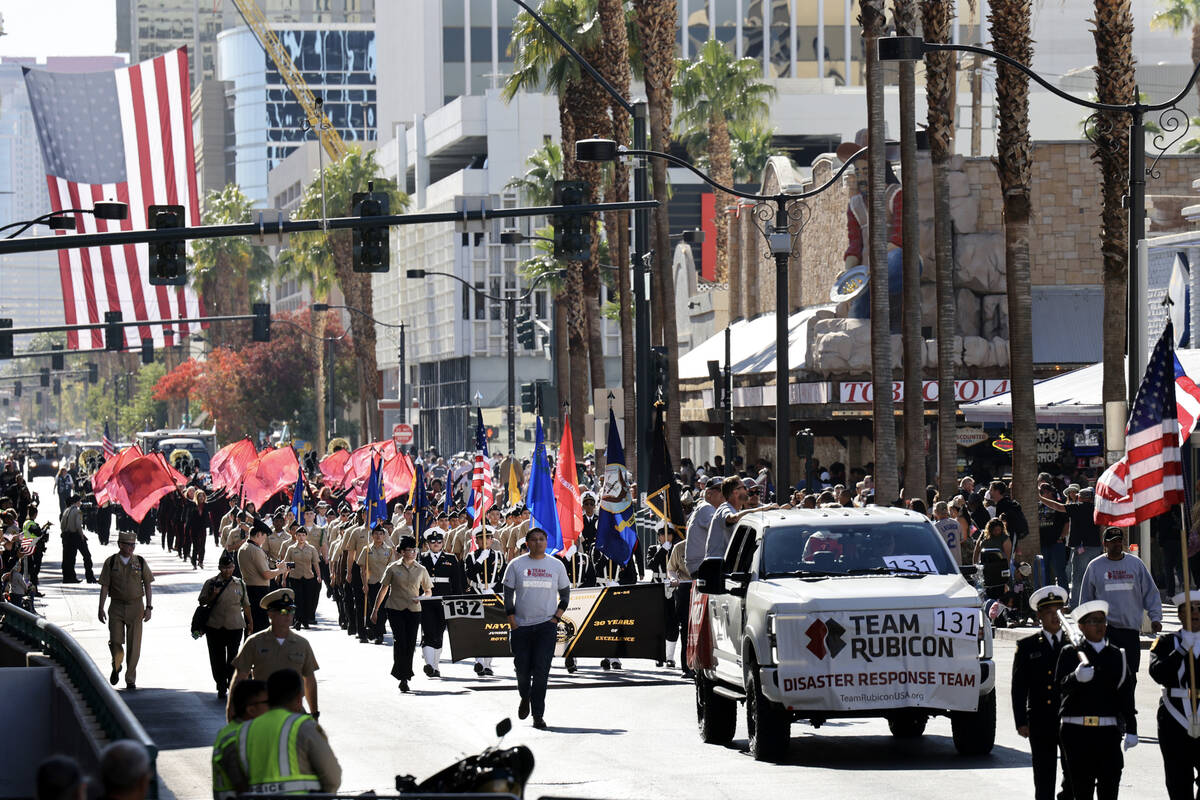 Team Rubicon veterans (131) and Clark High School Navy JROTC march during the Las Vegas Veteran ...