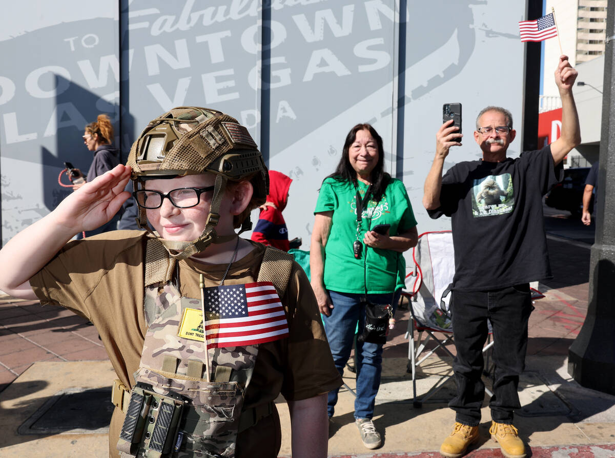 Andrew Peterson, 11, salutes during the Las Vegas Veterans Day Parade downtown Monday, Nov. 11, ...