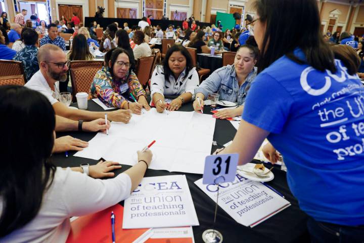 Louise Zhou, right, a teacher at Sunrise Mountain High School, watches as newly hired teachers ...