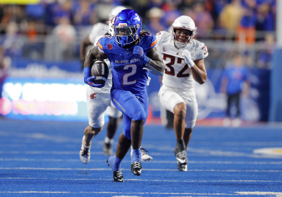 Boise State running back Ashton Jeanty (2) breaks away from the Washington State defense in the ...