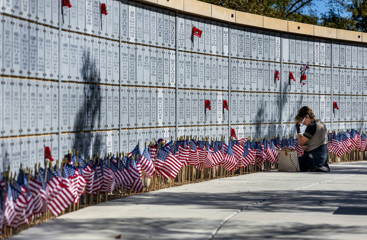 Jill D'Arpino reflects at the marker for her son Michael Kissel at one of the columbarium walls ...