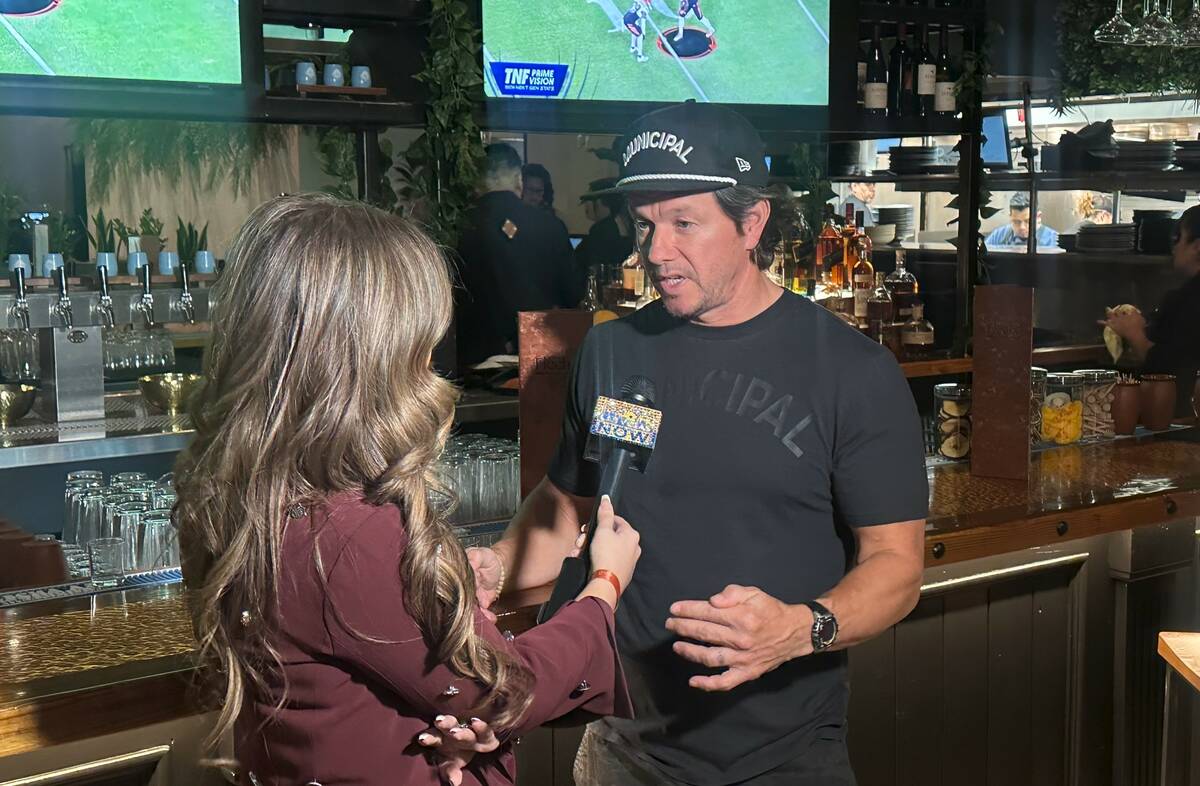 Mark Wahlberg is interviewed by Jillian Lopez at the opening party for Flecha Cantina at Town S ...