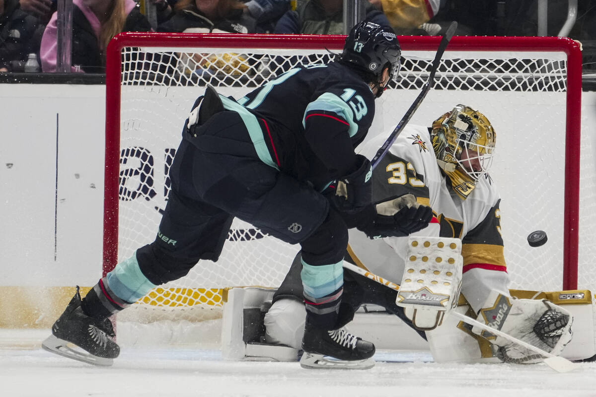 Vegas Golden Knights goaltender Adin Hill saves a shot from Seattle Kraken left wing Brandon Ta ...