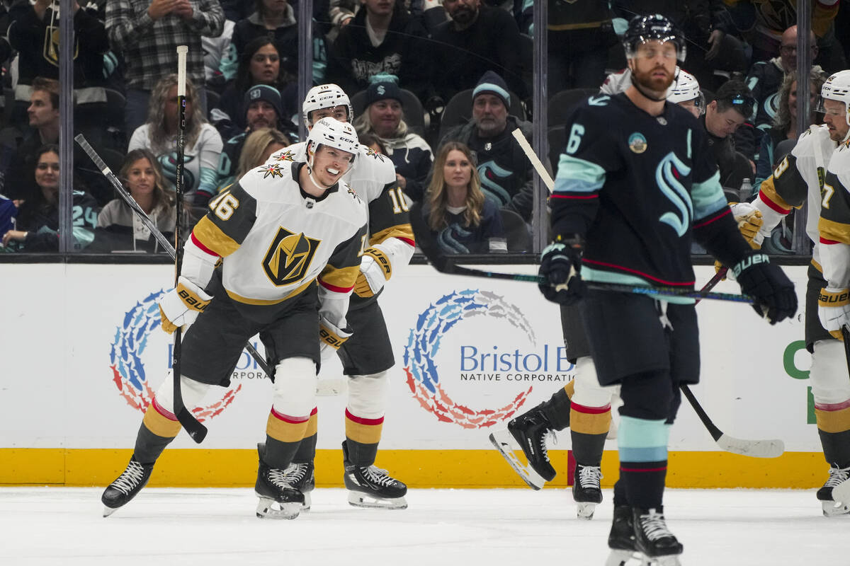 Vegas Golden Knights left wing Pavel Dorofeyev, front left, smiles after scoring against the Se ...