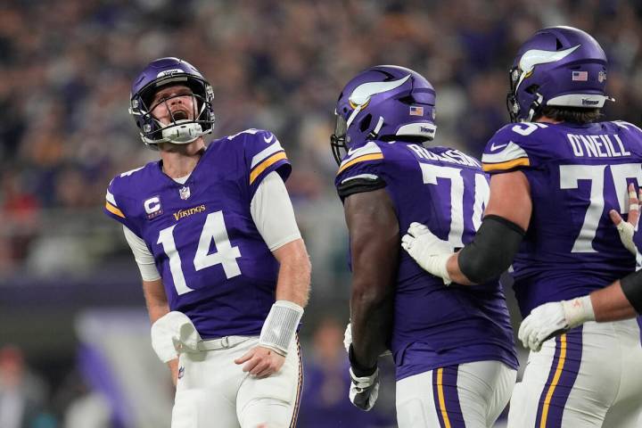 Minnesota Vikings quarterback Sam Darnold (14) celebrates after throwing a touchdown pass durin ...