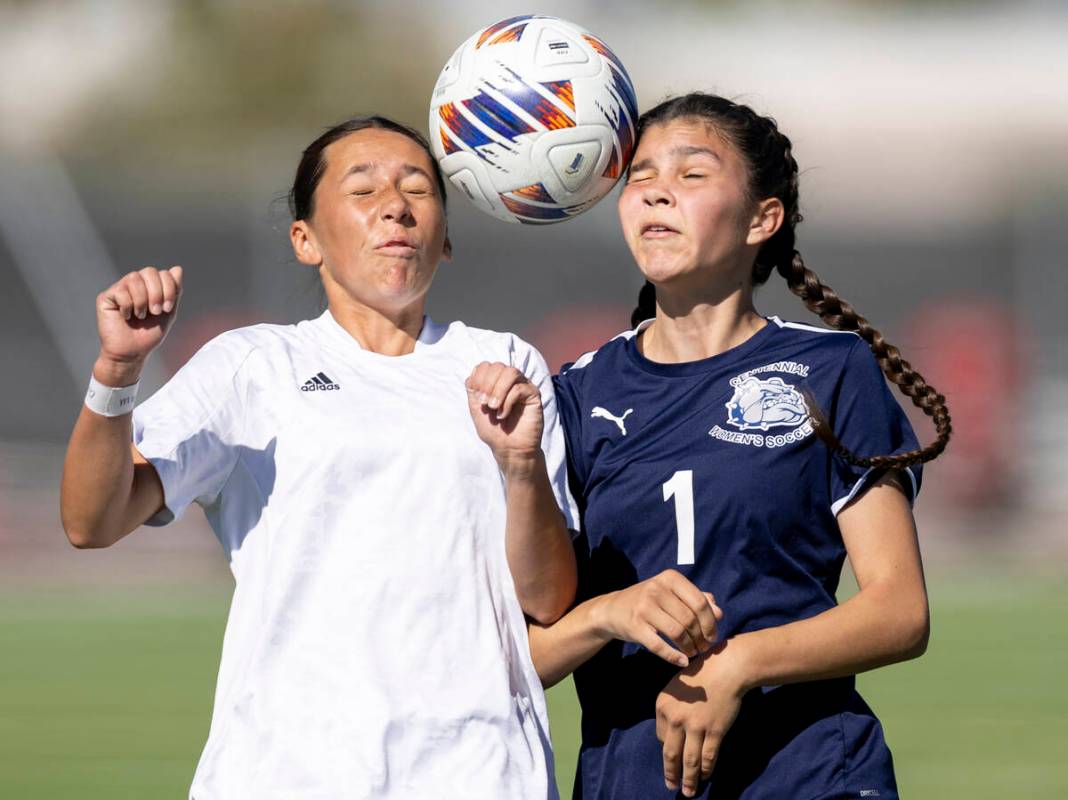 Galena freshman Gabriela Oberg, left, and Centennial freshman Alayna Malloy (1) compete for the ...