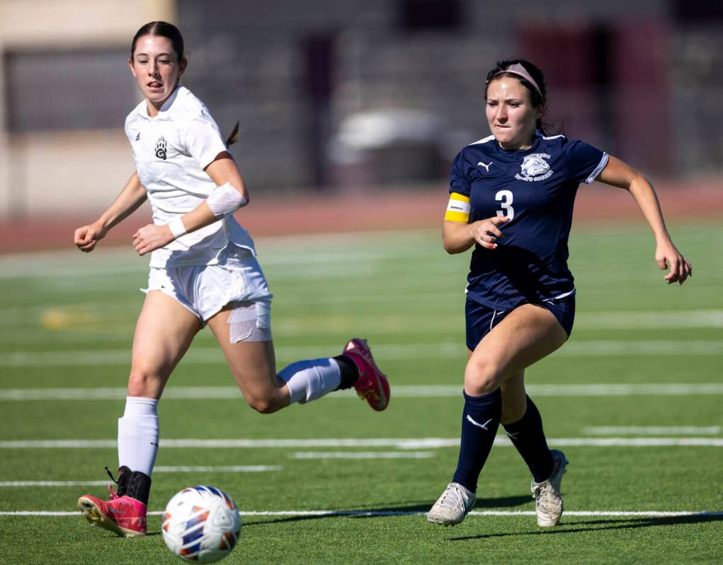 Galena midfielder Kennedy Hartley, left, and Centennial midfielder Natalie Sligar (3) compete f ...